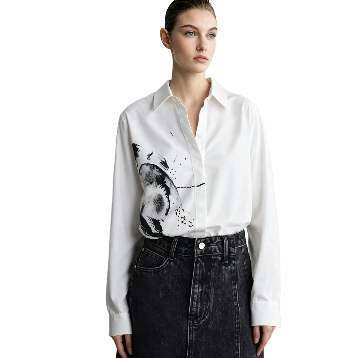 A model wearing a white long-sleeve button-up shirt with a black and gray abstract brushstroke print on the front, paired with a dark denim skirt. The brand name 'AMII' is visible in the top left corner.