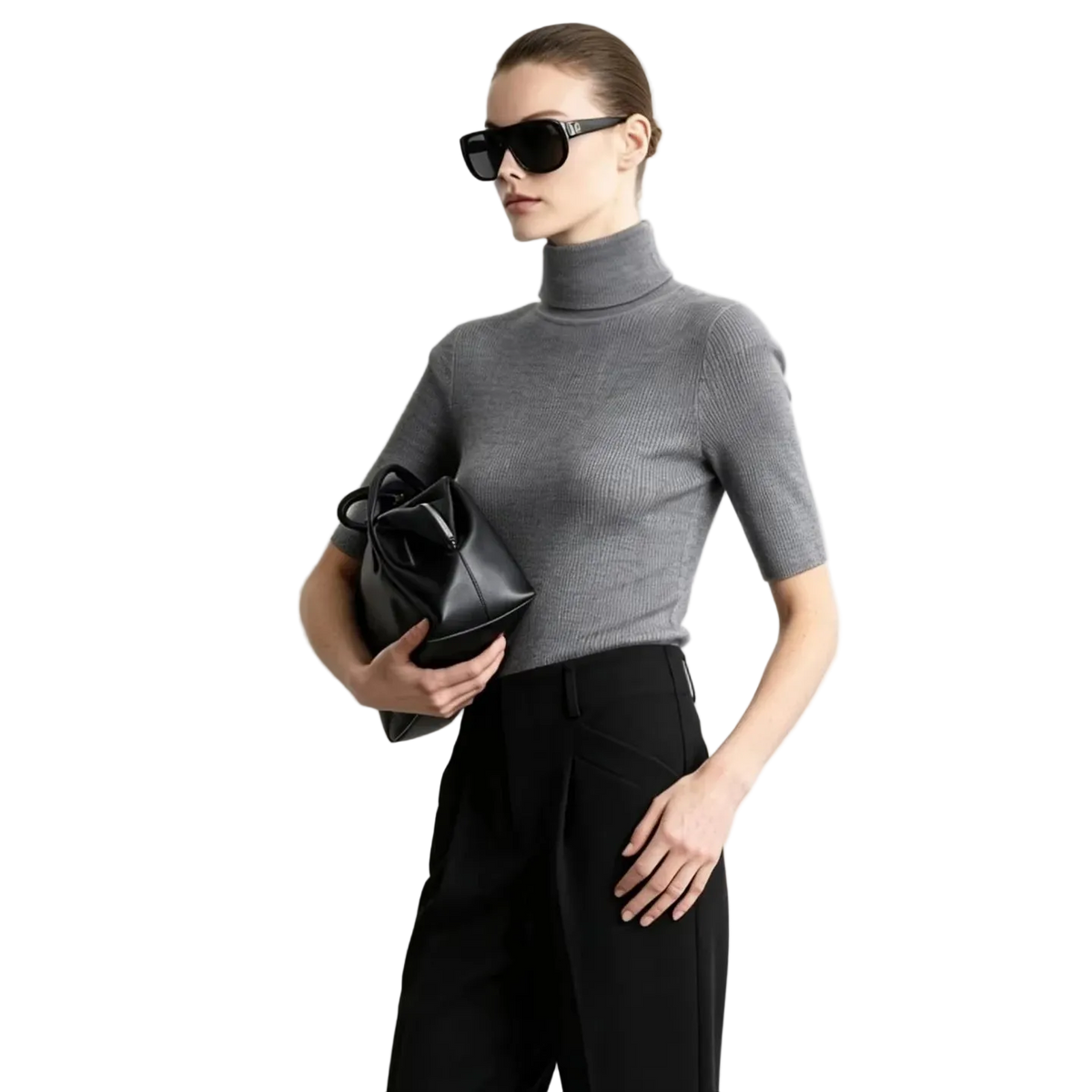 A woman modeling a fitted short-sleeve gray turtleneck sweater with black trousers and black sunglasses, holding a black handbag against a light gray studio background. The AMII brand name appears in the top left, along with a '100% sheep wool' label.
