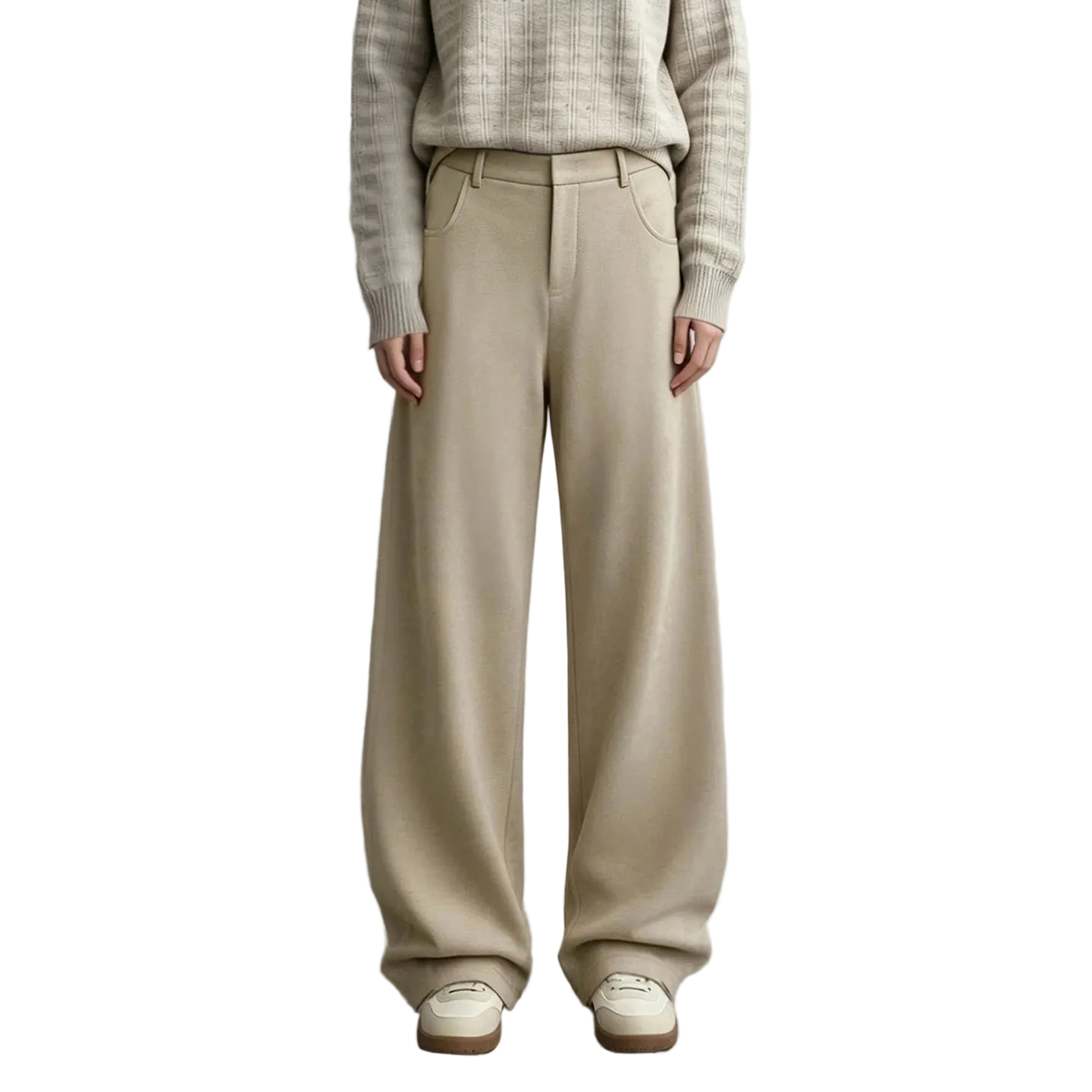 A model wearing AMII wide-leg knit trousers in a light beige color, paired with a textured beige sweater and cream shoes, standing against a neutral gray studio background.