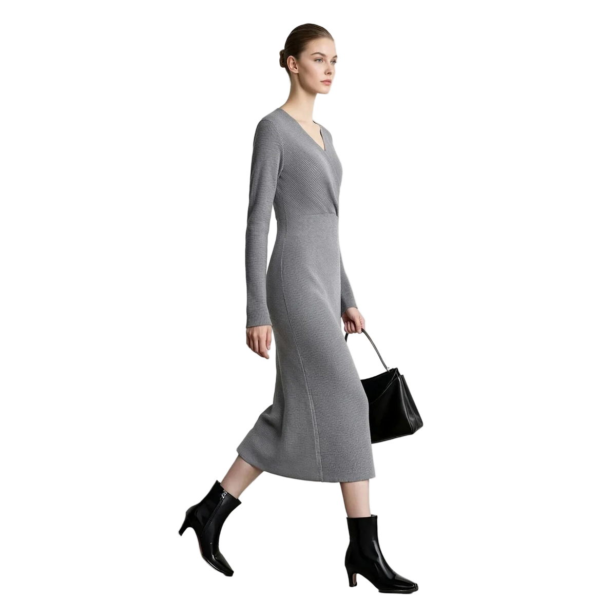 A woman models a long-sleeve gray knit midi dress with a V-neckline, paired with black ankle boots and a black handbag, set against a minimalist white studio background with the AMII logo in the top left corner.