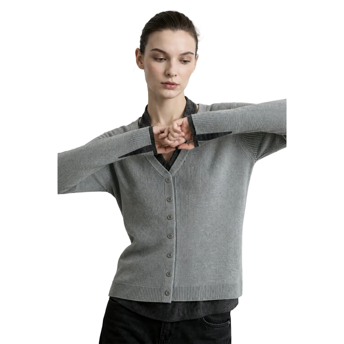 A woman modeling a light gray ribbed cardigan sweater with a V-neck and button front, layered over a black collared shirt. The brand name AMII is printed in black in the top left corner against a light gray background.