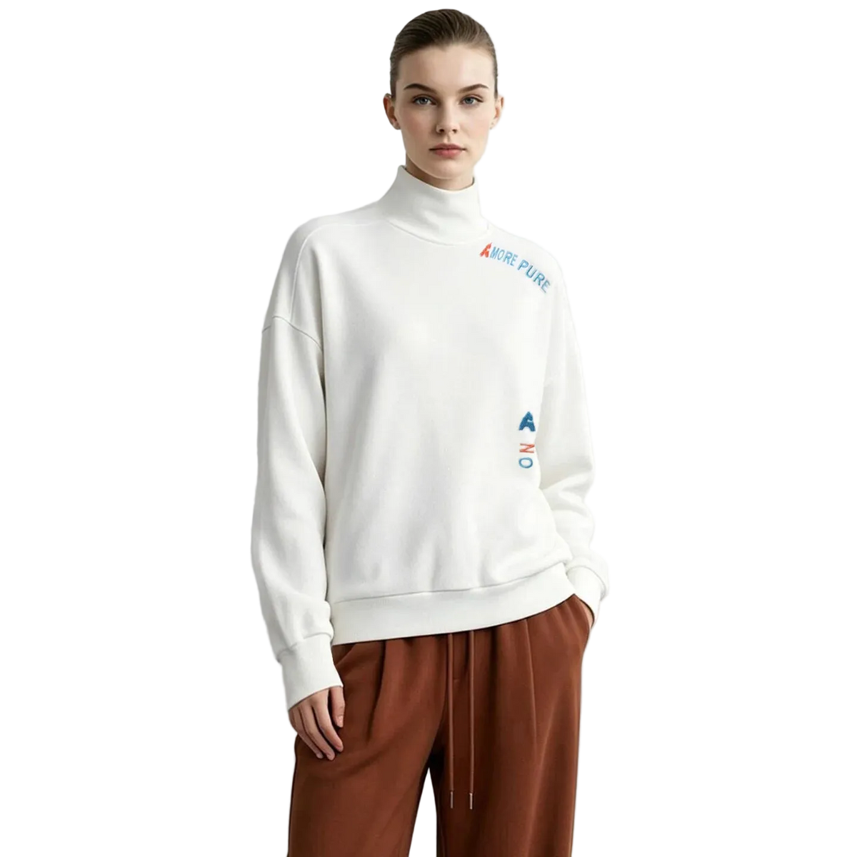 A model wearing an off-white AMII turtleneck sweatshirt with colorful embroidered logo details on the chest and waist, paired with brown drawstring pants, set against a plain light gray background.