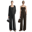 Two models wearing AMII wide-leg pants and matching tops in dark gray and dark brown, standing against a light gray wall. The left model wears a dark gray cardigan over a black tank top, and the right model wears a dark brown camisole with matching brown pants.