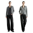 Two models standing side by side in a studio setting, wearing matching gray cardigans over dark V-neck tops and black wide-leg trousers.