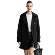 A model wearing a black double-breasted AMII coat over a white top and black shorts, holding a black textured handbag against a light gray studio background. An informational graphic on the left highlights the wrinkle-resistant, no-iron fabric.
