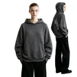 A model wears a dark gray AMII pullover hoodie with a kangaroo pocket, shown from the front and back against a minimalist light gray studio background.
